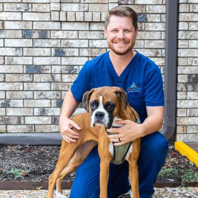 vet sitting with pet outside vet sitting with pet outside